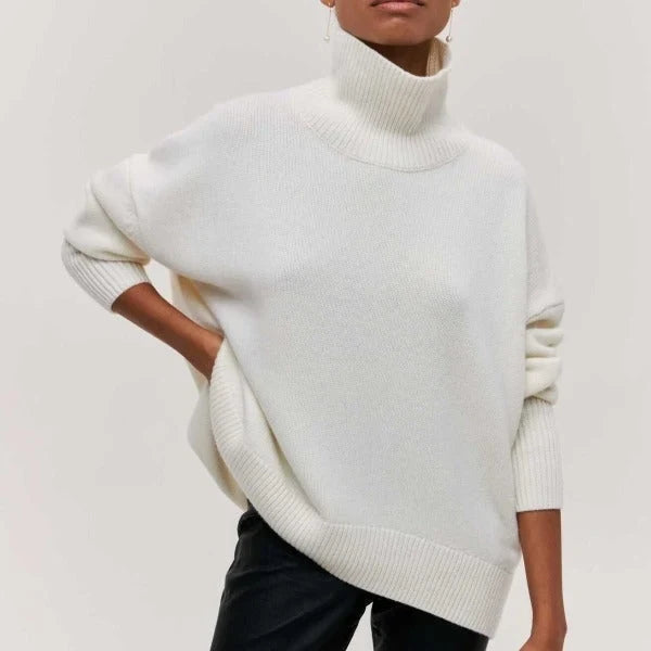 Serene Women’s Oversized Sweater featuring a stylish turtleneck collar and ribbed details, perfect for cozy and fashionable layering in cool weather. 7