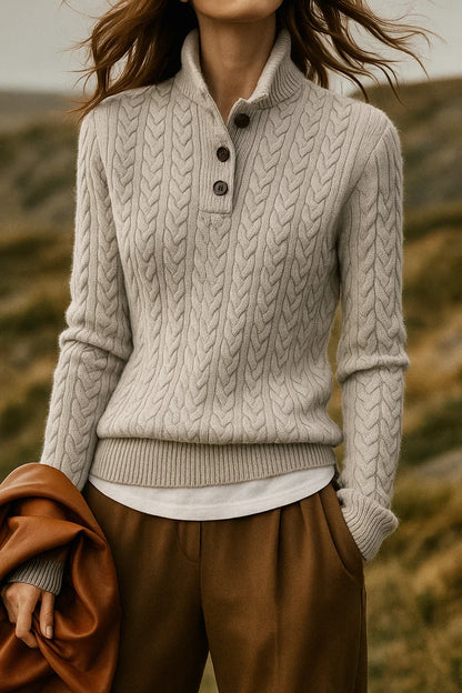 Cora Women’s sweater featuring a stylish cable knit design and button neck fastening, perfect for cozy fall and winter outfits. 10