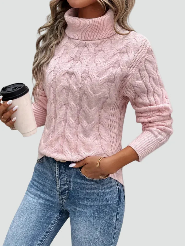 Cora Women’s Sweater featuring a stylish cable knit design and a cozy high turtleneck collar, perfect for fall and winter layering. 2