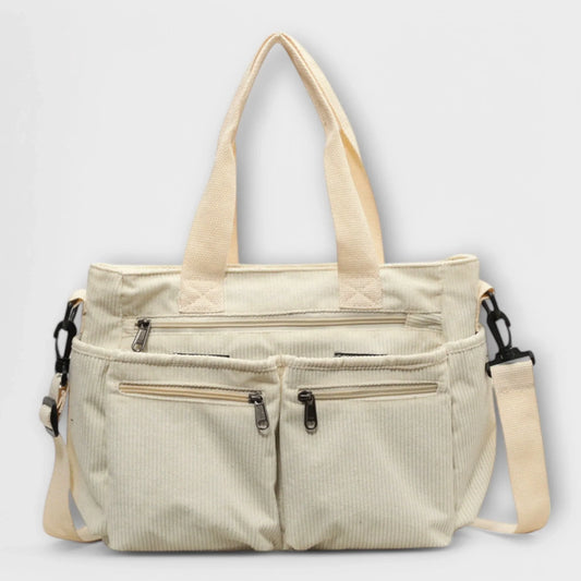 Olivia Tote Bag featuring a spacious interior and a secure zipper closure, perfect for everyday use and stylish storage. 0