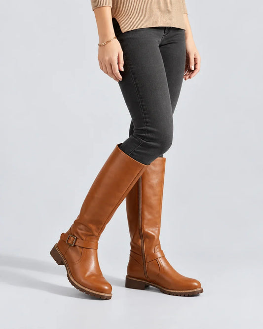 Riva Women’s Knee-High Riding Boots featuring a stylish buckle and convenient side zip, perfect for fashionable and comfortable everyday wear. 0