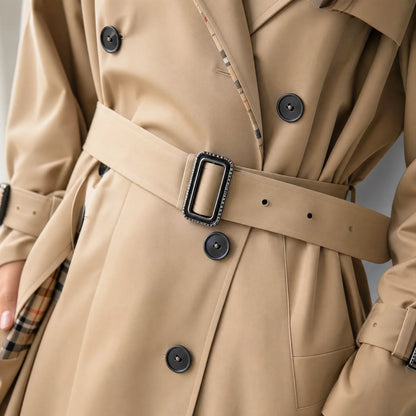 Tessa Women’s Trench Coat featuring a stylish double-breasted front and a belted waist, perfect for a chic and sophisticated look in any 2