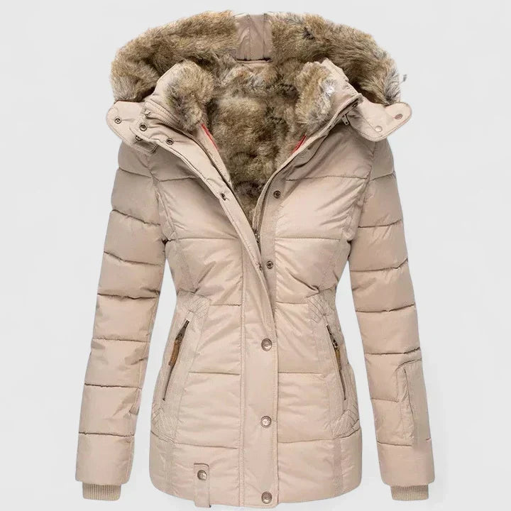Vela Women’s Coat featuring an adjustable hood and practical pockets, perfect for stylish warmth and functionality in cooler weather. 0