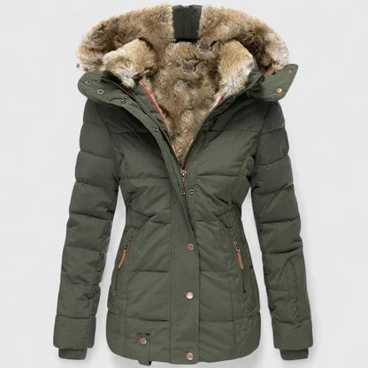 Vela Women’s Coat featuring an adjustable hood and practical pockets, perfect for stylish warmth and functionality in cooler weather. 1
