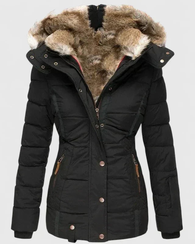 Vela Women’s Coat featuring an adjustable hood and practical pockets, perfect for stylish warmth and functionality in cooler weather. 2