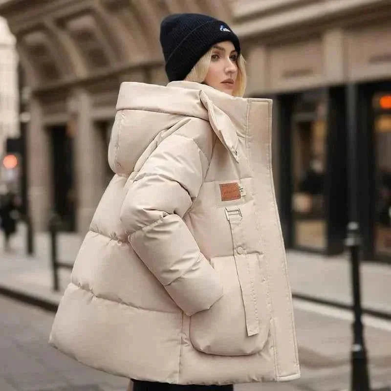 Wren Women's Winter Coat featuring a stylish funnel neck and padded insulation for warmth and comfort during cold weather. 1