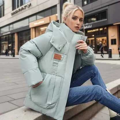 Wren Women's Winter Coat featuring a stylish funnel neck and padded insulation for warmth and comfort during cold weather. 2