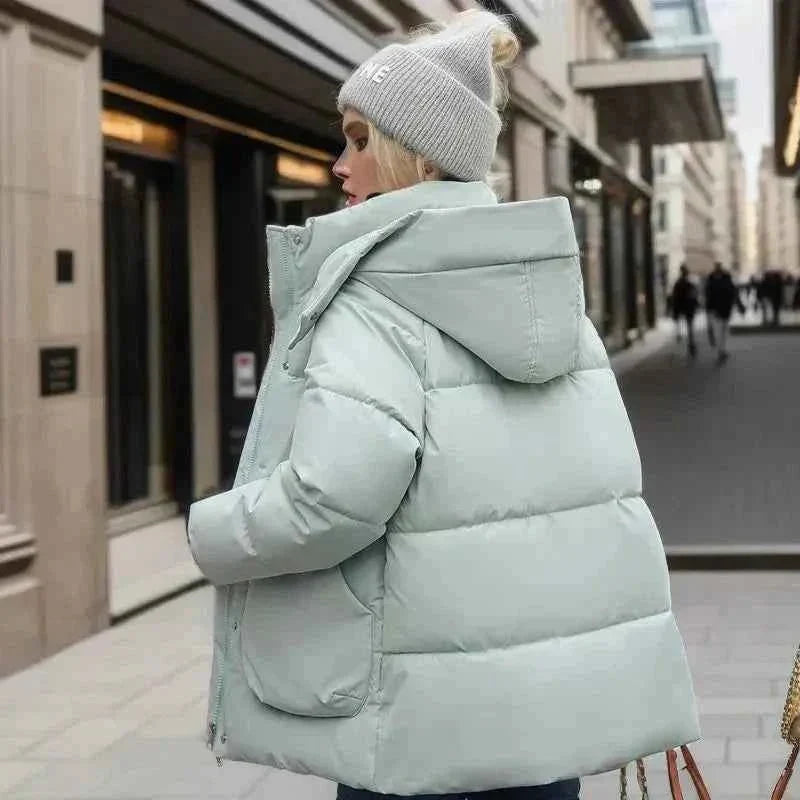 Wren Women's Winter Coat featuring a stylish funnel neck and padded insulation for warmth and comfort during cold weather. 4